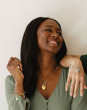 Girl wearing monogrammed gold jewelry